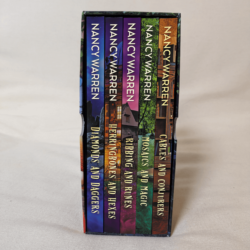 Stack of books by Nancy Warren on a light gray background