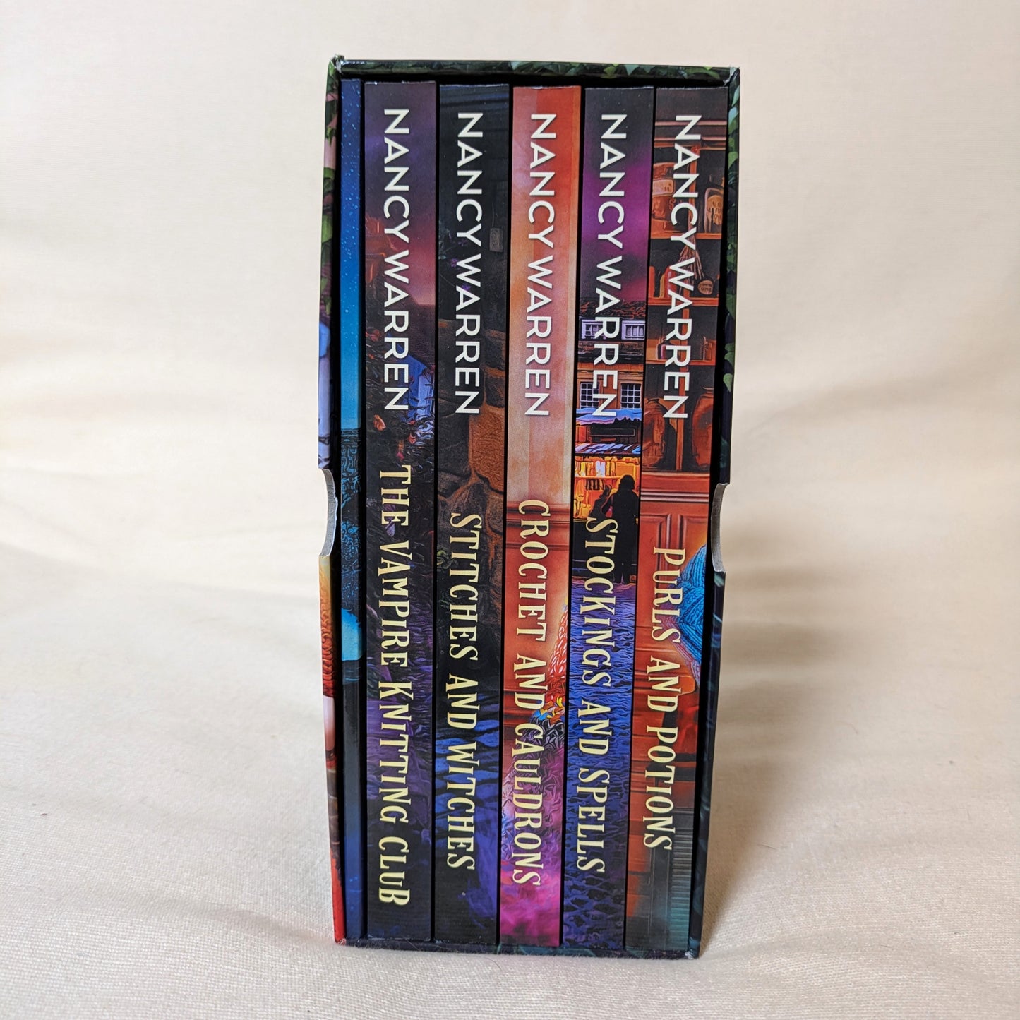 Stack of books by Nancy Warren on a light gray background