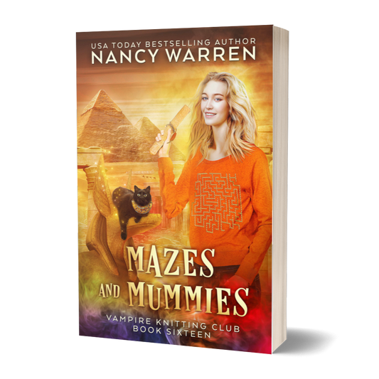 The paperback cover of Mazes and Mummies by Nancy Warren. A blonde woman holds an ancient papyrus in front of a background of Egyptian monuments. A black cat sits on a statue.
