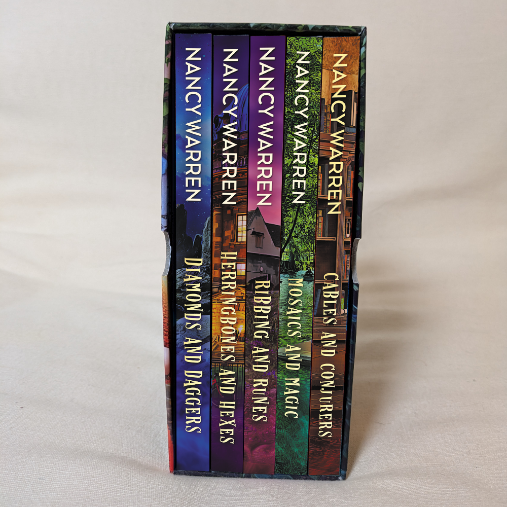 Stack of books by Nancy Warren on a light gray background